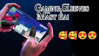 Hands holding a phone in landscape playing a game; banner reads 'Gaming Sleeves Mast Hai' with several emoji faces on the right.